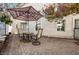 Back yard with stone pavers and comfortable seating area, ideal for entertaining at 2632 Starfish Ct, Las Vegas, NV 89128