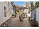 Back yard with stone pavers and shaded seating area perfect for relaxation at 2632 Starfish Ct, Las Vegas, NV 89128