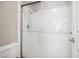 Bathroom with a white shower and tiled surround, and neutral colored walls at 2632 Starfish Ct, Las Vegas, NV 89128