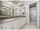 Bathroom featuring double sinks, a granite countertop, tile flooring, and a stand-up shower at 2632 Starfish Ct, Las Vegas, NV 89128