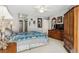 Bedroom with plush carpet, neutral colored walls, ceiling fan, and plenty of storage at 2632 Starfish Ct, Las Vegas, NV 89128