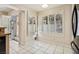 Bright breakfast nook features tile floor, many windows with shutters, and sliding glass doors at 2632 Starfish Ct, Las Vegas, NV 89128