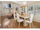 Open concept dining area showcasing wood floors and natural light from the many windows at 2632 Starfish Ct, Las Vegas, NV 89128