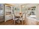 Bright dining room with a table that seats six, a cabinet, and outdoor access at 2632 Starfish Ct, Las Vegas, NV 89128