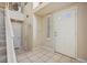 Inviting foyer with tile flooring, a staircase, and ample natural light at 2632 Starfish Ct, Las Vegas, NV 89128