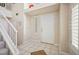 Bright foyer featuring tile flooring, a staircase, and a freshly painted interior at 2632 Starfish Ct, Las Vegas, NV 89128