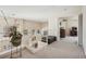 Second floor hallway with high ceilings, neutral carpets and view to other rooms at 2632 Starfish Ct, Las Vegas, NV 89128