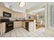 Modern kitchen with black appliances and light colored cabinets at 2632 Starfish Ct, Las Vegas, NV 89128