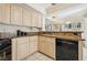 Modern kitchen with black appliances and light colored cabinets at 2632 Starfish Ct, Las Vegas, NV 89128