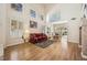 Spacious living room features hardwood floors, natural light, and access to the dining area at 2632 Starfish Ct, Las Vegas, NV 89128