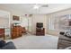 Bright and airy living room with large window, neutral walls, plush carpeting, and traditional-style furniture at 2632 Starfish Ct, Las Vegas, NV 89128