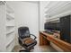 A cozy home office area is nestled within a well-organized closet featuring custom shelving and a built-in desk at 2632 Starfish Ct, Las Vegas, NV 89128