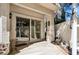 Charming outdoor patio with a sliding glass door and a cozy seating area, perfect for relaxation at 2632 Starfish Ct, Las Vegas, NV 89128