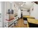 Spacious storage room with ceiling fan, custom shelving, and numerous containers for optimal organization at 2632 Starfish Ct, Las Vegas, NV 89128