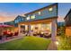 Wonderful backyard featuring a covered patio, artificial turf and a relaxing outdoor seating area at 27 Parco Fiore Ct, Henderson, NV 89011