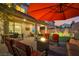 Inviting backyard patio with a fire pit, comfortable seating, and outdoor dining area for relaxing evenings at 27 Parco Fiore Ct, Henderson, NV 89011