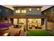 This outdoor space offers covered dining, lounge seating, a fire pit, and low maintenance artificial grass at 27 Parco Fiore Ct, Henderson, NV 89011