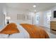 Bright bedroom with a king-size bed, art, and a view into the ensuite bathroom at 27 Parco Fiore Ct, Henderson, NV 89011