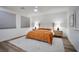 Serene bedroom featuring a king-size bed, neutral decor, and two bedside tables with lamps at 27 Parco Fiore Ct, Henderson, NV 89011