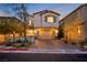 Charming two-story home with a two-car garage and brick-paved driveway, nicely landscaped at 27 Parco Fiore Ct, Henderson, NV 89011