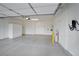 Spacious garage with epoxy flooring, built-in storage cabinets, and an EV charger at 27 Parco Fiore Ct, Henderson, NV 89011