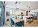 Open-concept kitchen with modern appliances, a large island, and adjacent dining area at 27 Parco Fiore Ct, Henderson, NV 89011