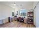Well-lit home office with a large window, desk, bookshelf, and mini-fridge, ideal for productivity at 27 Parco Fiore Ct, Henderson, NV 89011