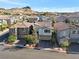 Charming neighborhood street view featuring well-maintained homes and beautiful desert landscaping at 27 Parco Fiore Ct, Henderson, NV 89011