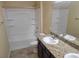 Bathroom featuring a tub/shower combo, vanity with granite counters, and a large mirror at 2748 Brinkley Manor St, Laughlin, NV 89029