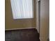 Bedroom with large window and closet, featuring neutral paint and plush carpeting at 2748 Brinkley Manor St, Laughlin, NV 89029