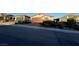 Single-story home with a two-car garage, landscaped front yard, and muted earth-tone colors at 2748 Brinkley Manor St, Laughlin, NV 89029