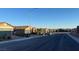 Street view of single-Gathering homes with well-maintained landscaping and sidewalks in a well-planned community at 2748 Brinkley Manor St, Laughlin, NV 89029