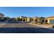 Charming single-story homes line a quiet street with well-maintained landscaping and sidewalks in a desirable neighborhood at 2748 Brinkley Manor St, Laughlin, NV 89029