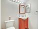 Cozy half-bathroom features a wood vanity, mirror, and sleek fixtures at 3261 Ennis Ct, Las Vegas, NV 89121