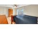 This primary bedroom features a ceiling fan, closet, and a sliding glass door to the patio at 3261 Ennis Ct, Las Vegas, NV 89121