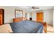 This primary bedroom features a ceiling fan, closet, and a large wood dresser at 3261 Ennis Ct, Las Vegas, NV 89121