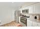 Updated kitchen features stainless steel appliances, ample counter space, and pantry access at 3261 Ennis Ct, Las Vegas, NV 89121