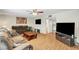 Inviting living room with sleek floors, ceiling fan, and neutral decor at 3261 Ennis Ct, Las Vegas, NV 89121