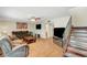 Cozy living room with hardwood floors, ceiling fan, and staircase at 3261 Ennis Ct, Las Vegas, NV 89121