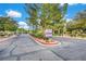 Street view of the Tiburon Estates neighborhood entrance showcasing lush landscaping at 3261 Ennis Ct, Las Vegas, NV 89121