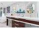 Modern bathroom with marble and tile accents, dual vanities, and soaking tub at 3586 Spencer St, Las Vegas, NV 89169