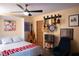 Cozy bedroom with ceiling fan, music instruments, and unique decor at 3586 Spencer St, Las Vegas, NV 89169