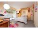 Bright bedroom with flamingo themed decor and a sliding glass door to a private outdoor space at 3586 Spencer St, Las Vegas, NV 89169