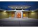 Striking mid-century modern home with an orange door, stone accents, and unique architectural details at 3586 Spencer St, Las Vegas, NV 89169
