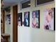 Hallway adorned with framed photos, displaying a personalized and artistic touch at 3586 Spencer St, Las Vegas, NV 89169