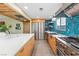 Open design with stainless steel appliances, stylish backsplash, and spacious island at 3586 Spencer St, Las Vegas, NV 89169