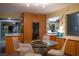 Kitchen and dining area with modern light fixture, bird sculptures, and wine fridge at 3586 Spencer St, Las Vegas, NV 89169