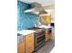 Bright kitchen showcasing stainless appliances, stylish backsplash, and a gas range at 3586 Spencer St, Las Vegas, NV 89169