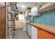 Bright laundry room with colorful cabinets, modern washer and dryer at 3586 Spencer St, Las Vegas, NV 89169