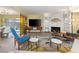 Bright living room featuring a unique stone fireplace, modern furniture, and an open layout at 3586 Spencer St, Las Vegas, NV 89169